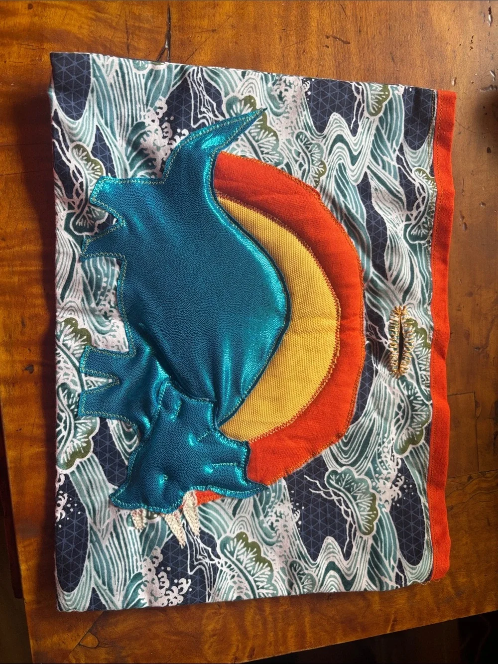 Teal Metallic Dinosaur Appliqué Cloth with Orange & Yellow Sun